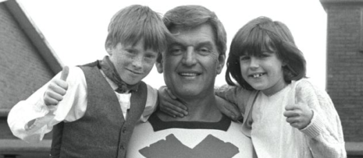 the green cross code man with two children