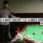 A mate has shattered a pint of beer while playing a snooker shot to prevent drink driving. Text on screen reads: 'Because a mate doesn't let a mate drink drive. #MatesMatter'