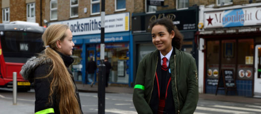 two girls talking in the street