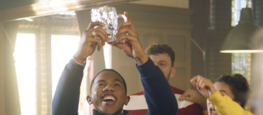 holding glass in the air with car keys in