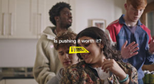 A group of mates hanging out at home. Text reads: 'Is pushing it worth it? THINK!'