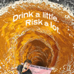 An animation of a young man trying to escape from his driving licence as it's being sucked into a whirpool of beer in a pint glass. The text reads in Welsh 'Diod fach. Risg fawr.' and in English 'Drink a little. Risk a lot'